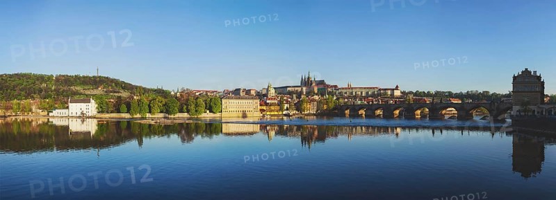 Panorama view of Charles bridge over Vltava river and Gradchany (Prague Castle) and St. Vitus Cathedral in the morning, Prague, Czech Republic, Europe