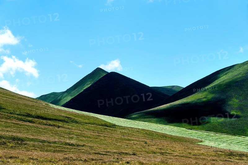 The Monts Dore. Regional park of the Auvergne volcanoes. The Puy de Monne and in the background the Puy Barbier at the Croix Morand pass, Puy de Dome department. Auvergne Rhone Alpes. France