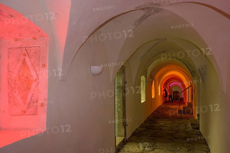 Colourfully illuminated cloister in the Carthusian monastery of Allerengelberg, Schnalstal Valley, Karthaus, South Tyrol, Italy, Europe