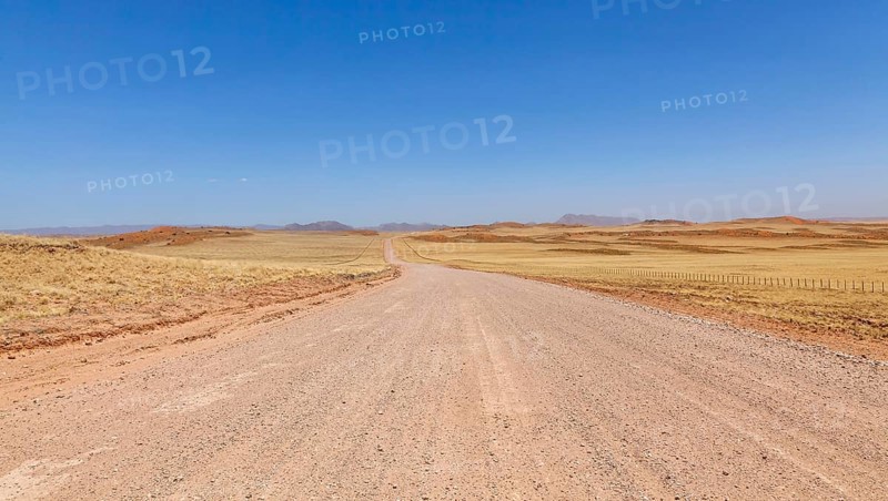 Gravel road C14, in the background the Tiras Mountains, Namibia, Africa