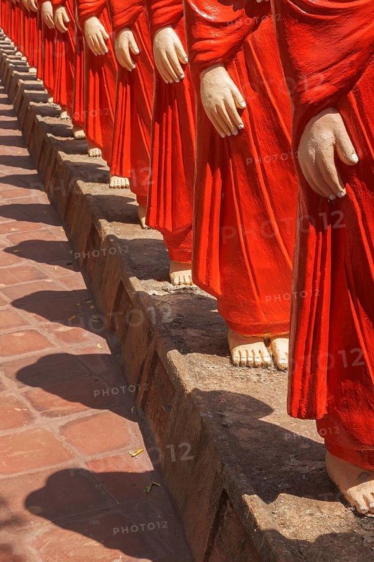 ANURADHAPURA, SRI LANKA, SEPTEMBER 26, 2009: 500 statues of Buddhist monks (Arahants) in Nellikulama Temple walking after Buddha