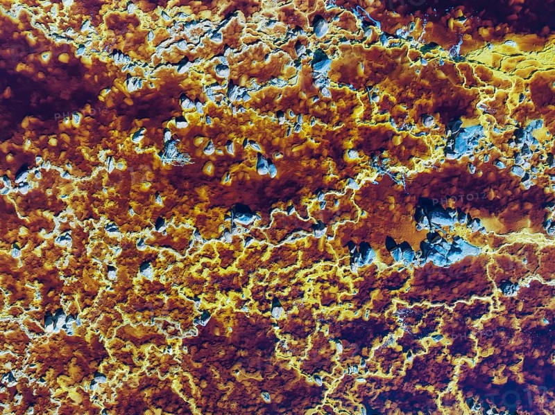 Detail of the Rio Tinto (Red river) with its deep reddish hue due to oxidised iron minerals in its water, aerial view, drone shot, Huelva province, Andalusia, Spain, Europe