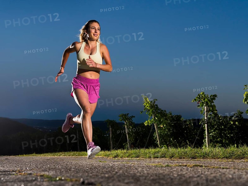 Young woman in Fitness training, vineyard at Grossheppach, Remstal valley, Baden Württemberg, Germany, Europe