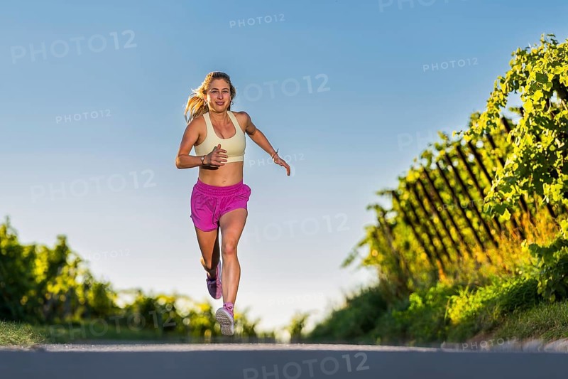 Young woman in Fitness training, vineyard at Grossheppach, Remstal valley, Baden Württemberg, Germany, Europe