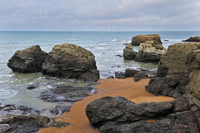 Eroded sea stacks at the Plage des Cinq Pineaux at Saint-Hilaire-de-Riez, La Vendée, Pays de la Loire, France, Europe