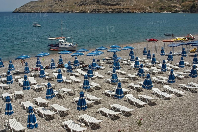 Rhodes Island, Lindos, Lindos is a town on the Greek island of Rhodes. Its landmark is the acropolis on a rock with huge archways from the 4th century and reliefs dating from around 280 BC
