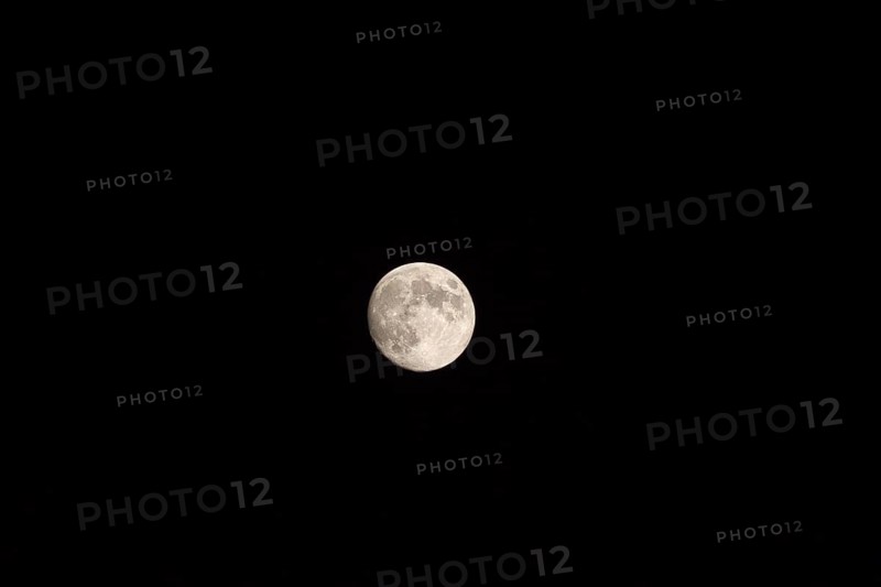 Full moon in the night sky, Arcachon, France, Europe