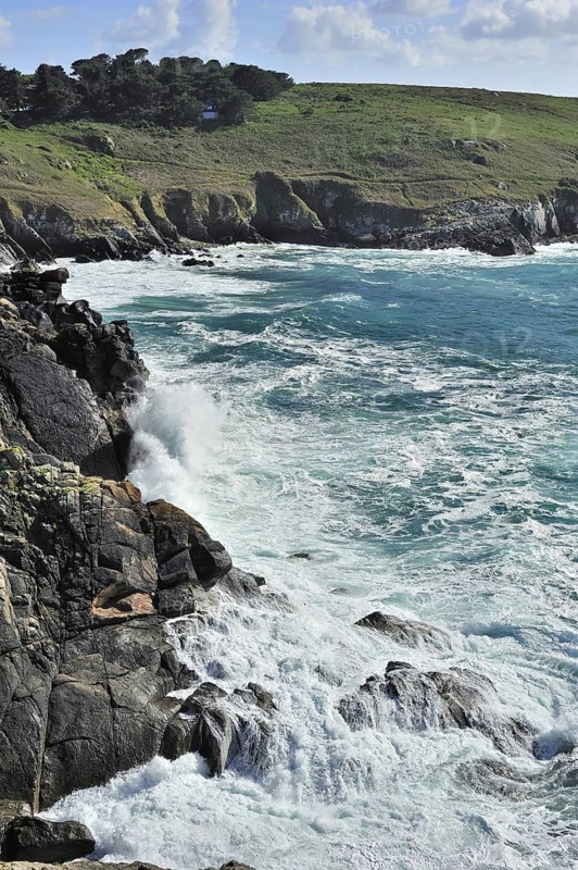 Waves crashing on the rocks of sea cliff at the Pointe du Millier at Beuzec-Cap-Sizun, Finistère, Brittany, France, Europe