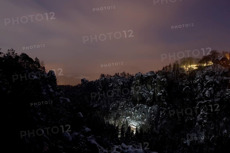 Bastei rock at full moon in winter