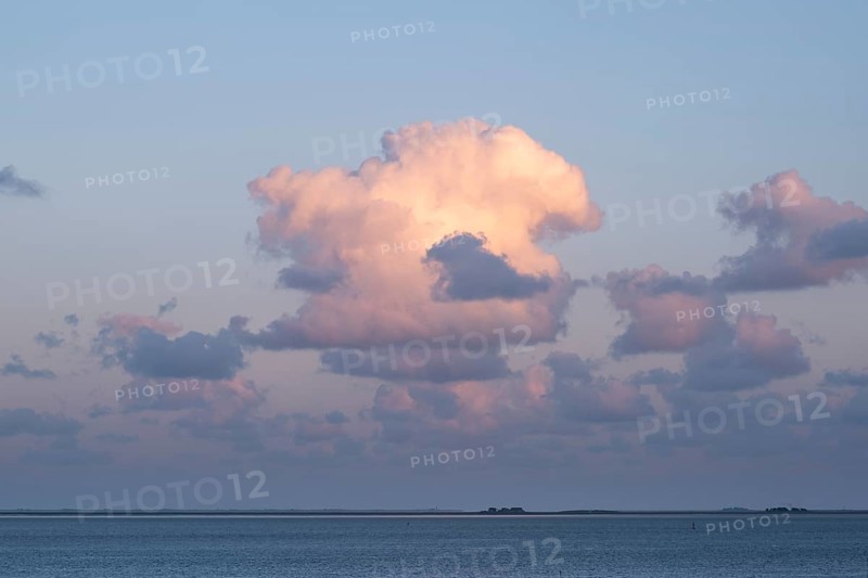Clouds in the evening light over the North Sea, in the background the Halligen, Wyk, Föhr, North Sea island, North Frisia, Schleswig-Holstein, Germany, Europe