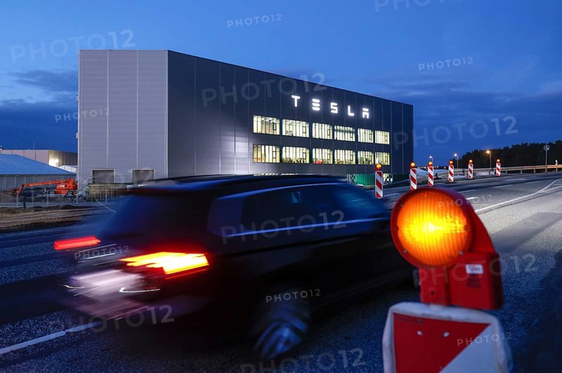 A car drives past the battery factory of the Tesla plant, Grünheide, 13.01.2023