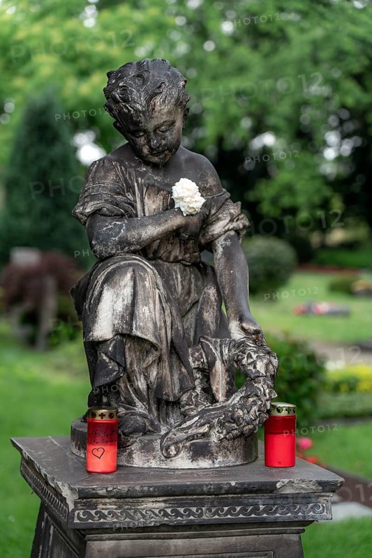 Figure in a cemetery, old gravestone, with flower and grave light, North Rhine-Westphalia, Germany, Europe