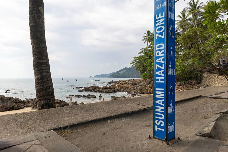 Tsunami Hazard Zone. Warning sign, signposting of escape routes in the event of another seaquake. Beach area and coastal road in the town of Patong, Kathu, Phuket Island, Thailand, Asia