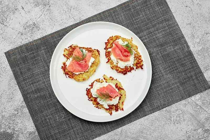 Top view of potato flapjack with salmon and cream cheese