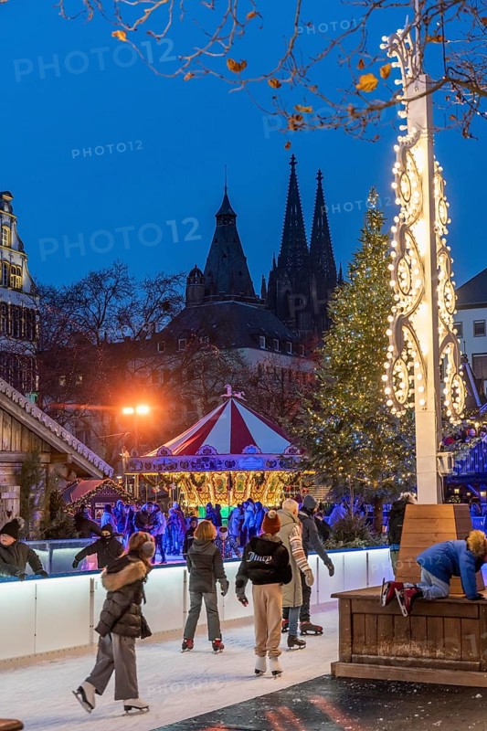 Ice rink at the Christmas market on the Heumarkt in the old town of Cologne, Cologne Cathedral, Sunday shopping in Cologne city centre, 1st Advent weekend, North Rhine-Westphalia, Germany, Europe