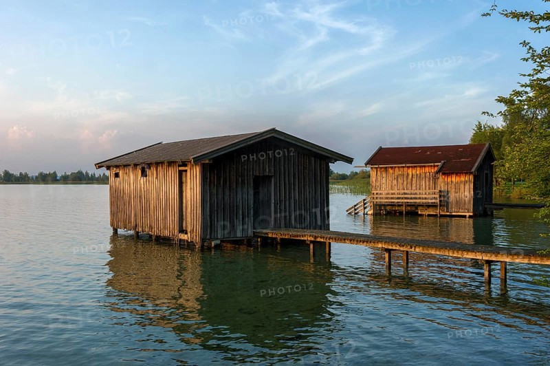 Boat huts with wooden jetty, sunset at Lake Kochel near Kochel am See, Bavarian Alpine foothills, Alps, Upper Bavaria, Bavaria, Germany, Europe