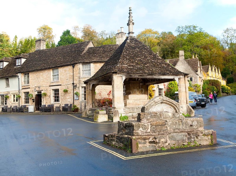 Fourteenth century stone market cross in Castle Combe, Wiltshire, England, UK claimed to be England's prettiest village