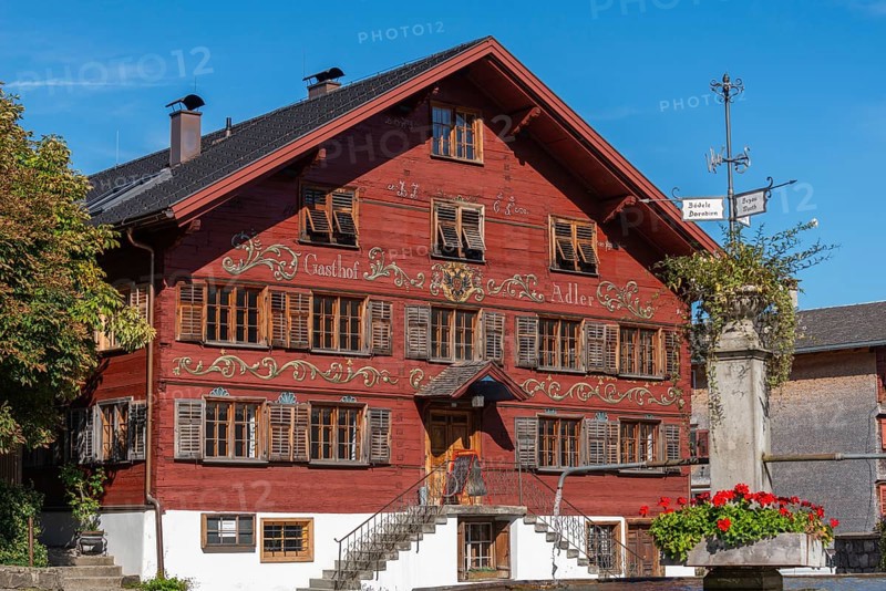 Schwarzenberg, village square with fountain, historic inn from 1765, facade, inscription, Bregenz district, Bregenzerwald, wooden house, architecture, flower boxes, Voralberg, Austria, Europe