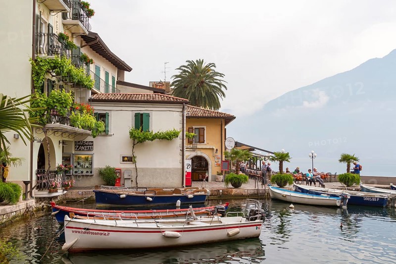 Old harbour with boats of Limone sul Garda, Lake Garda, Province of Brescia, Lombardy, Northern Italy, Italy, Europe