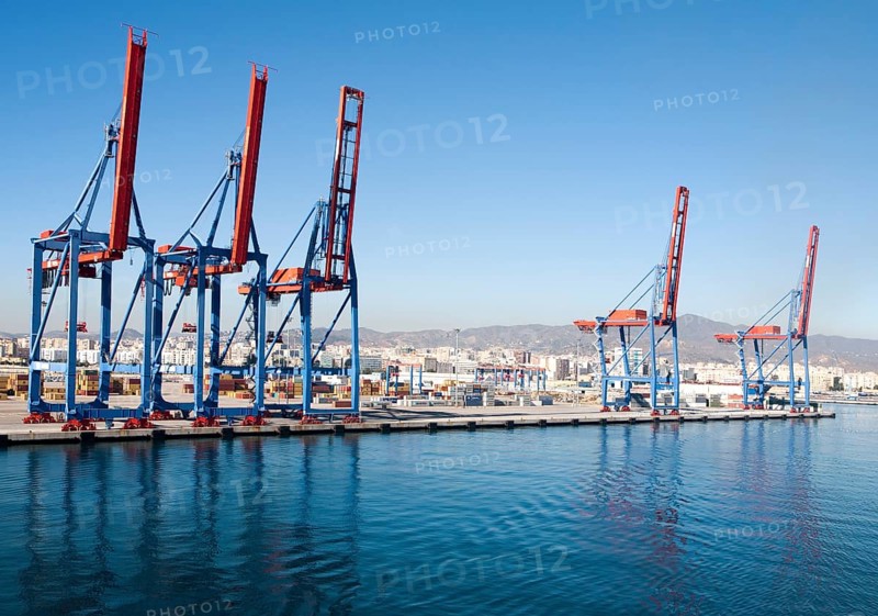 Cranes standing on quayside in the port of Malaga, Spain, Europe
