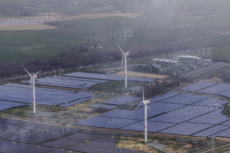 Aerial view of wind turbines and solar installations, taken near Wischhafen, 25/03/2024