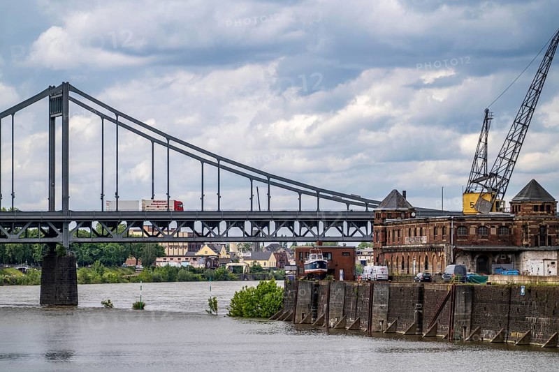 The Krefeld-Uerdingen bridge over the Rhine, between Krefeld and Duisburg, a bridle belt bridge from 1936, 858 metres long, federal road B228, shows severe bridge damage, restricted traffic on the bridge, is to be replaced, Rhine port Krefeld, North Rhine-Westphalia, Germany, Europe