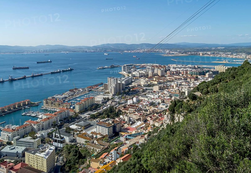 View of the city of Gibraltar and cable car near the top of the Rock of Gibraltar
