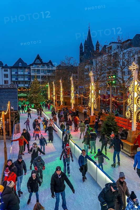 Ice rink at the Christmas market on the Heumarkt in the old town of Cologne, Sunday shopping in Cologne city centre, 1st Advent weekend, North Rhine-Westphalia, Germany, Europe
