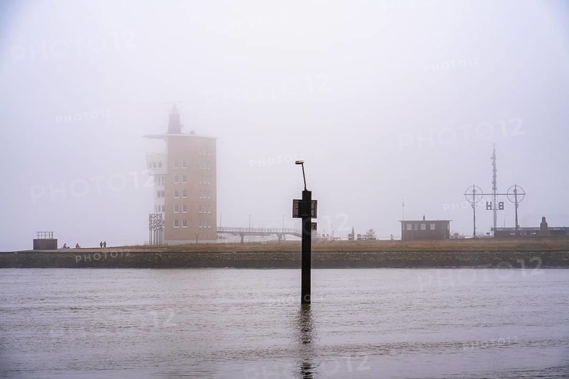 Thick fog in winter, hanging over the mouth of the Elbe into the North Sea, radar tower of the Water and Shipping Authority (WSA) Cuxhaven, semaphore, at the viewpoint Alte Liebe in Cuxhaven, Lower Saxony, Germany, Europe