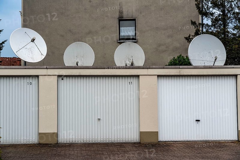 Housing estate in Oberhausen-Osterfeld, garages with large satellite dishes, North Rhine-Westphalia, Germany, Europe