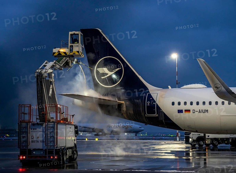Winter at Frankfurt Main Airport, FRA, Lufthansa aircraft being de-iced by de-icing vehicles, Hesse, Germany, Europe