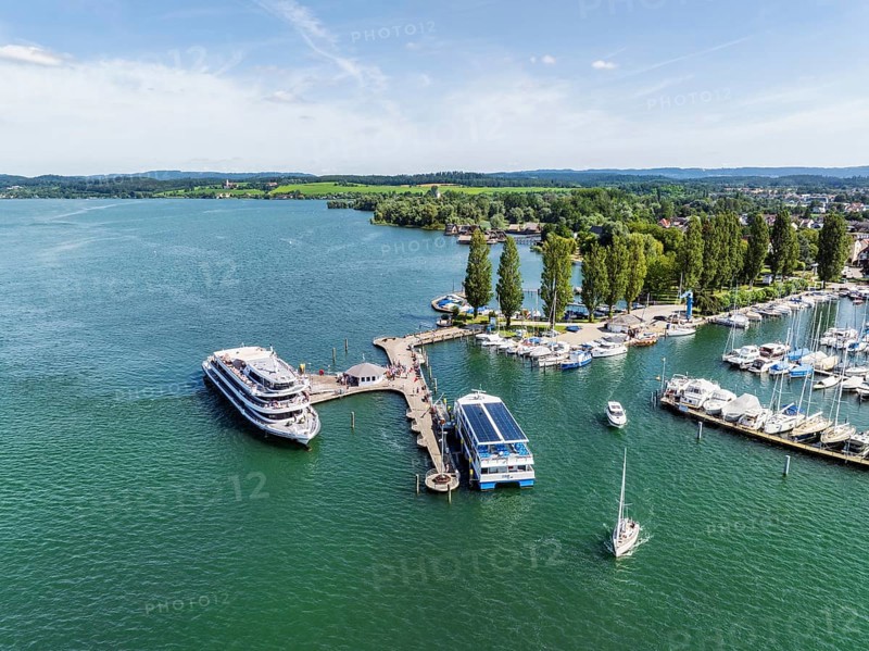 The yacht harbour, marina, harbour of Unteruhdlingen, Uhldingen-Mühlhofen with the passenger ship MS Überlingen of the Lake Constance-Schiffsbetriebe, behind it the pile dwellings, pile dwelling museum, Lake Constance district, Lake Constance, Baden-Württemberg, Germany, Europe