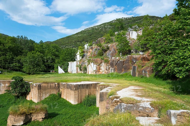 Quarry surrounded by lush greenery and clear skies, Kavala, Dímos Kaválas, Eastern Macedonia and Thrace, Greece, Europe