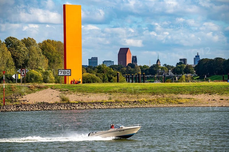 The sculpture Rhine Orange at the mouth of the Ruhr into the Rhine, skyline of the city centre of Duisburg, tower of the North Rhine-Westphalia State Archive, town hall tower and Salvator Church, North Rhine-Westphalia, Germany, Europe