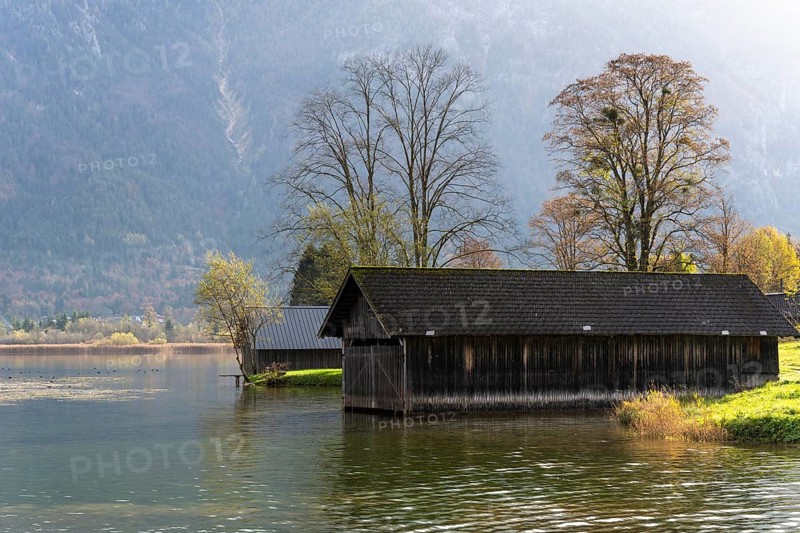 Lake Hallstatt near Steeg. Some boathouses. Autumn, backlight. Lake Hallstatt, Salzkammergut, Upper Austria, Austria, Europe