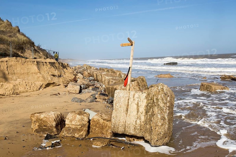 March 20 2018 Hemsby, UK. Coast path sign left abandoned by coastal erosion at Hemsby, Norfolk, England, UK