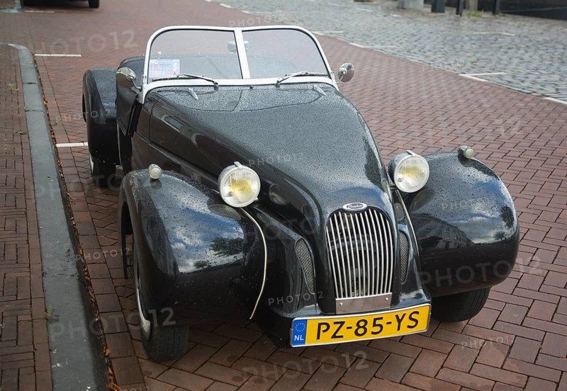 Burton brand self-assembly kit open top car parked on street Netherlands