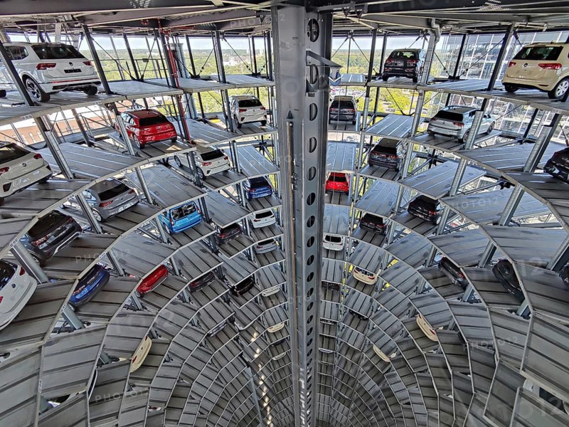 An illuminated car tower with new cars for delivery in the evening, detail, Autostadt, Volkswagen AG, Wolfsburg, Lower Saxony, Germany, Europe