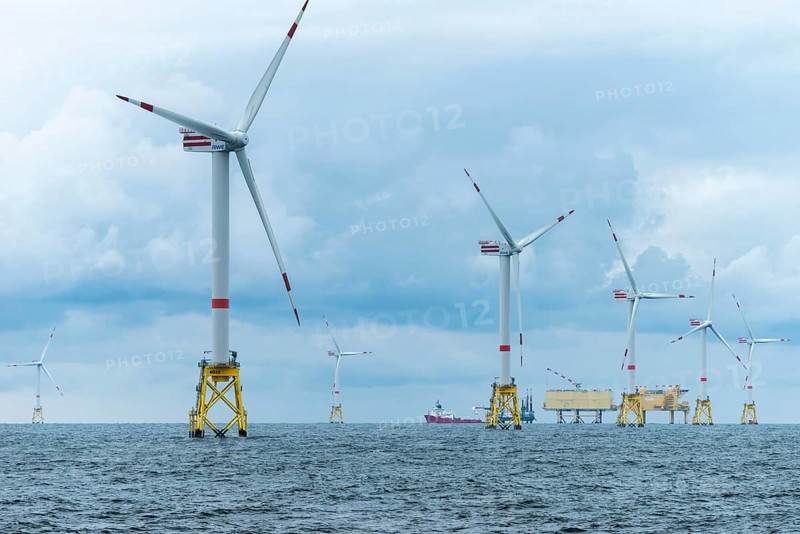 Offshore wind farm Nordsee Ost, operator RWE, north of Helgoland, German economic zone, wind turbines with jacket foundation structure, low swell, supply station, ship tug, Germany, Europe