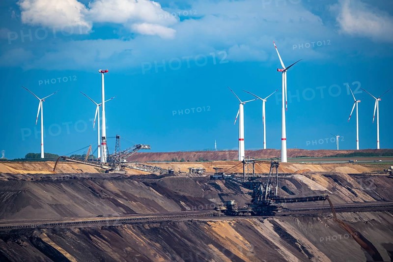 Lignite opencast mine Garzweiler II, excavator filling up the pit at the eastern edge of the opencast mine, wind farm, wind power plants, Jüchen, North Rhine-Westphalia, Germany, Europe