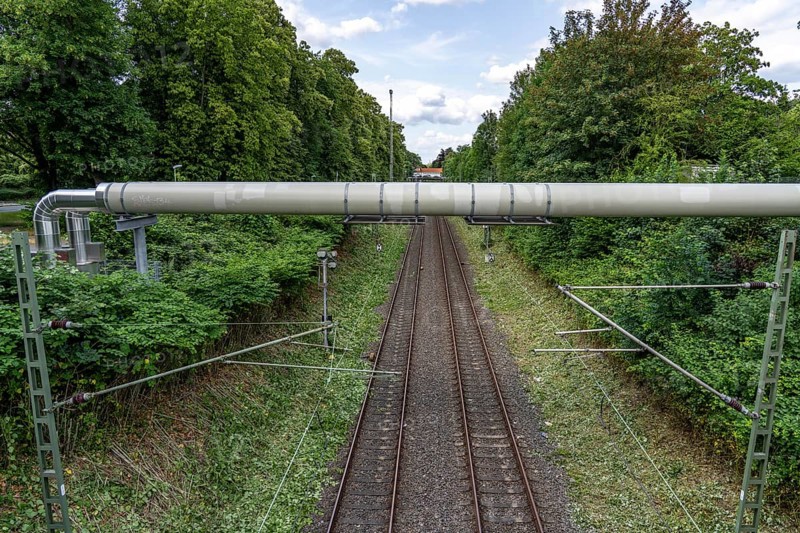 New STEAG district heating pipeline in Essen, over the railway tracks of the S6 line in Essen-Süd, part of the new 12 km long eastern route through the city, North Rhine-Westphalia, Germany, Europe