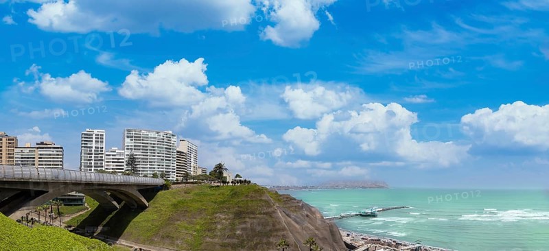 Peru, Lima, scenic ocean view and Miraflores Malecon promenade with shopping malls cafes and restaurants, South America