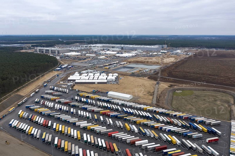 View of the Tesla Giga Factory site, with containers and swap trailers in the foreground, Grünheide, 28 01 2023