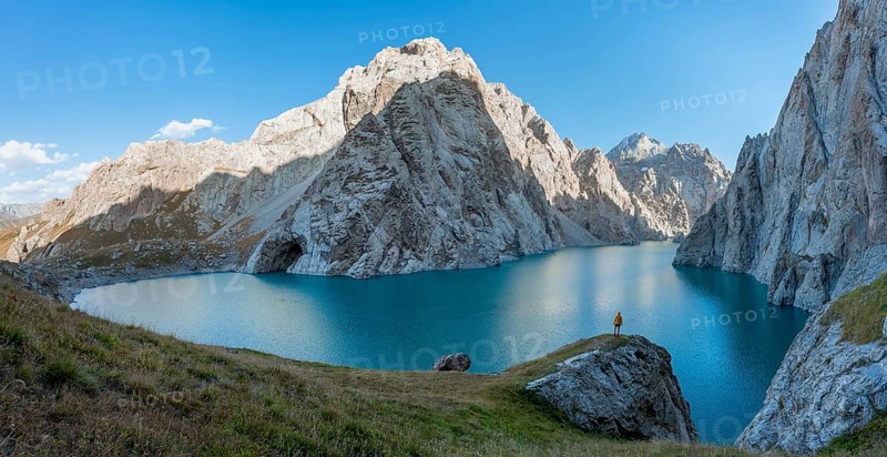 Hiker in front of Kol Suu Mountain Lake, Kol Suu Lake, Sary Beles Mountains, Naryn Province, Kyrgyzstan, Asia