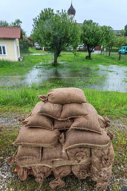 Sandbags, continuous rain, high water, flooding, town, houses, Whitsun floods 2013, climate change, Schlehdorf, Alpine foothills, Bavaria, Germany, Europe