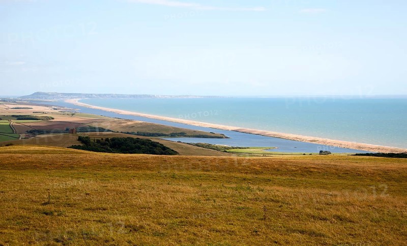 View west along Chesil beach tombolo from Abbotsbury to the Isle Portland, Dorset, England, UK