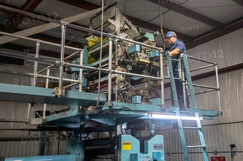 Liberal, Kansas, Dimas Diaz works on the printing press at the Leader & Times. Besides its own paper, the company prints weekly community newspapers for publishers in Kansas, Colorado, Texas, and Oklahoma, helping to keep local journalism alive. Across the country, more than 2, 000 local newspapers have closed in recent years