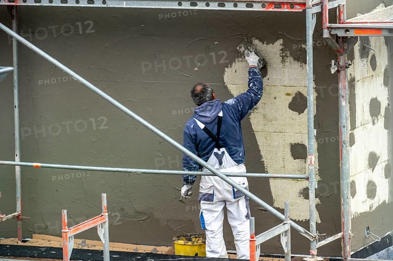 Building site, thermal insulation, external insulation, facade insulation, insulated facade of a new building being plastered, Duisburg, North Rhine-Westphalia, Germany, Europe