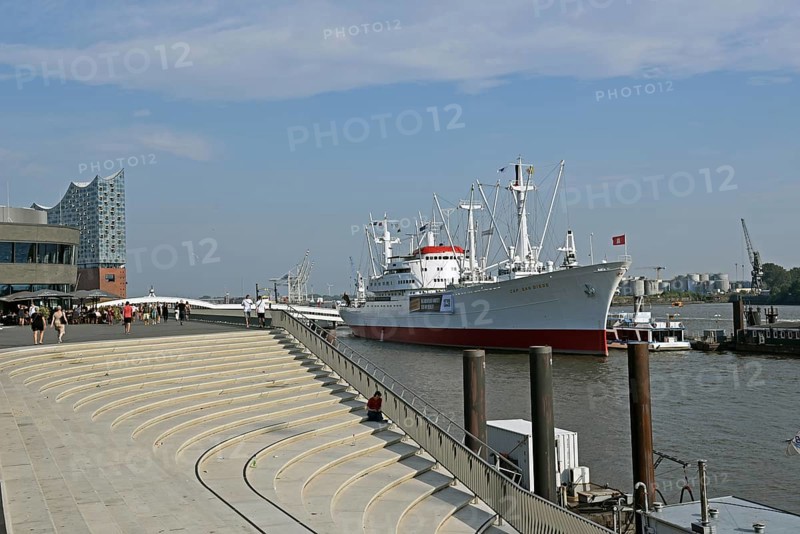 Europe, Germany, Hanseatic City of Hamburg, Harbour, Elbe, museum ship Cap San Diego, Jan Fedder Promenade, flood protection system, view to the Elbe Philharmonic Hall and Überseebrücke, Europe