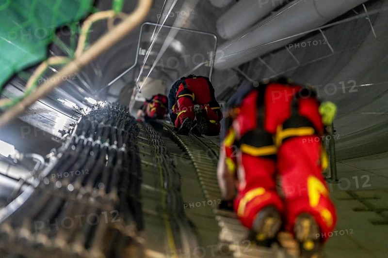 Height rescuers from the Oberhausen professional fire brigade practise abseiling from a wind turbine from a height of 150 metres, ascent into the turbine, to the nacelle, Issum, North Rhine-Westphalia, Germany, Europe